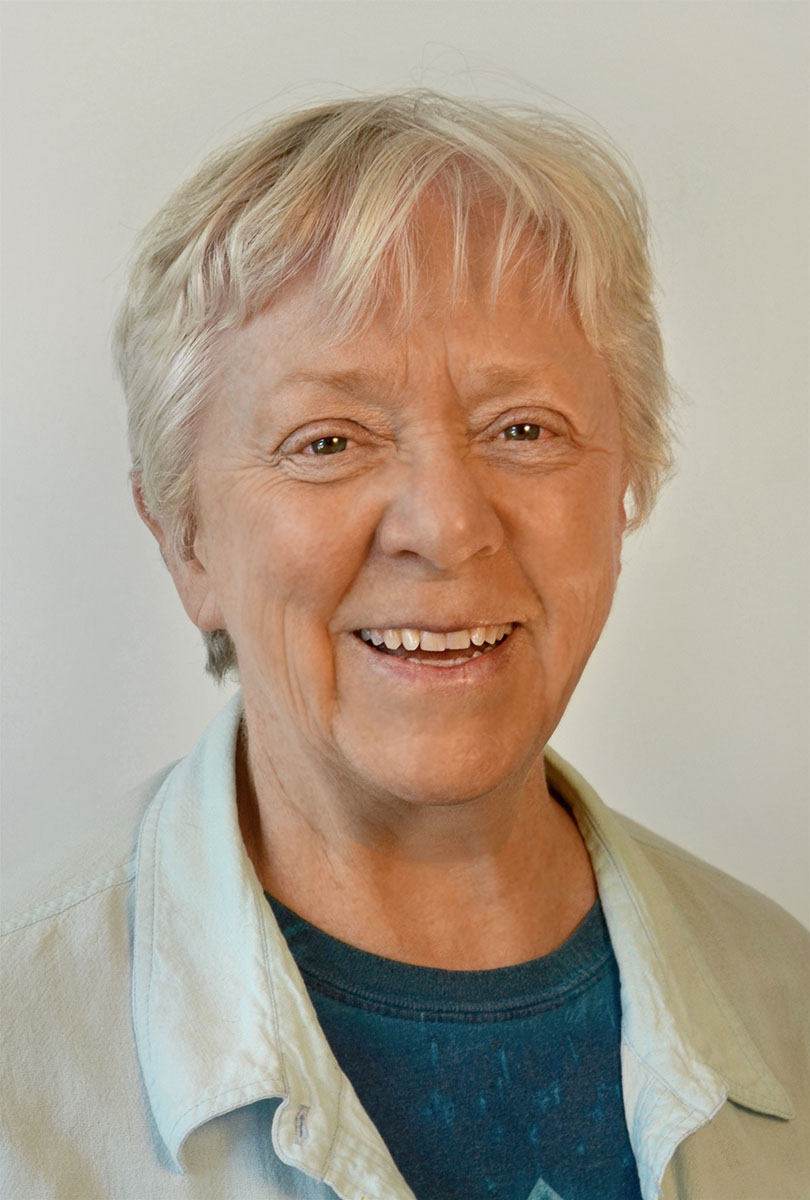 A headshot of Jane Good, smiling